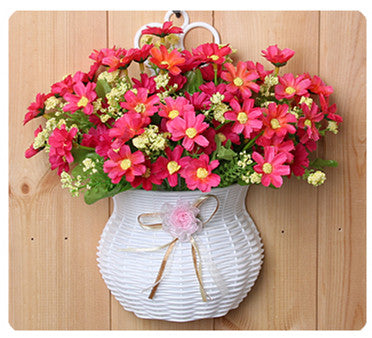 Plastic vase with silk flowers hanging basket